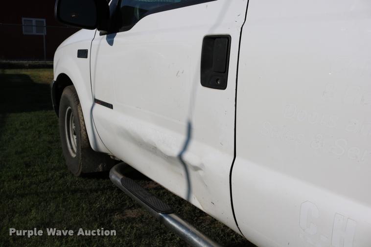 image for item DD0196 1999 Ford F350 Super Duty Crew Cab flatbed pickup truck