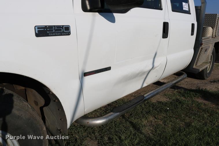 image for item DD0196 1999 Ford F350 Super Duty Crew Cab flatbed pickup truck