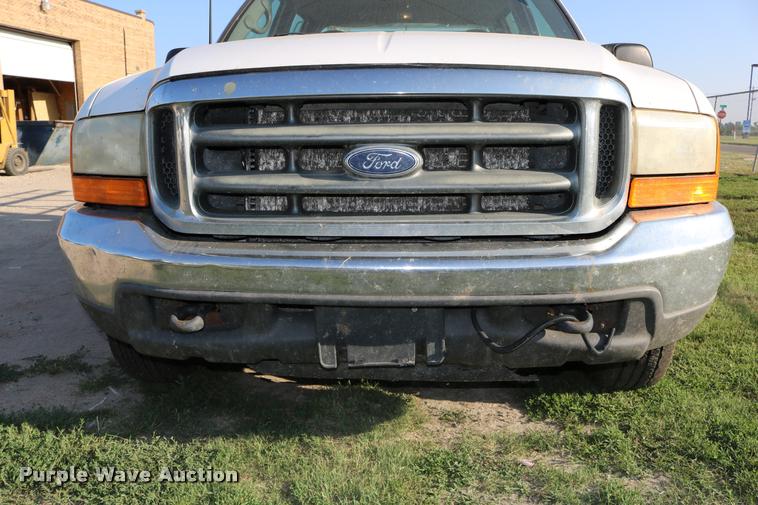 image for item DD0196 1999 Ford F350 Super Duty Crew Cab flatbed pickup truck