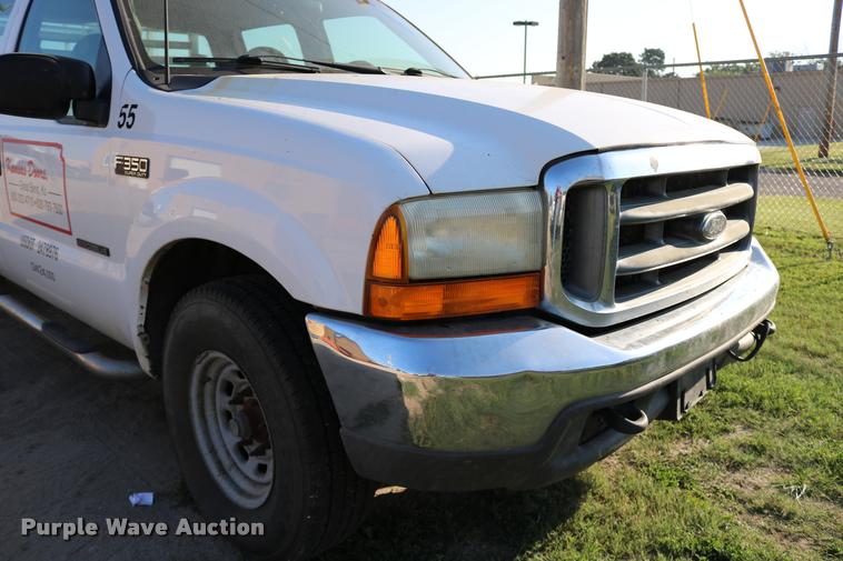 image for item DD0196 1999 Ford F350 Super Duty Crew Cab flatbed pickup truck