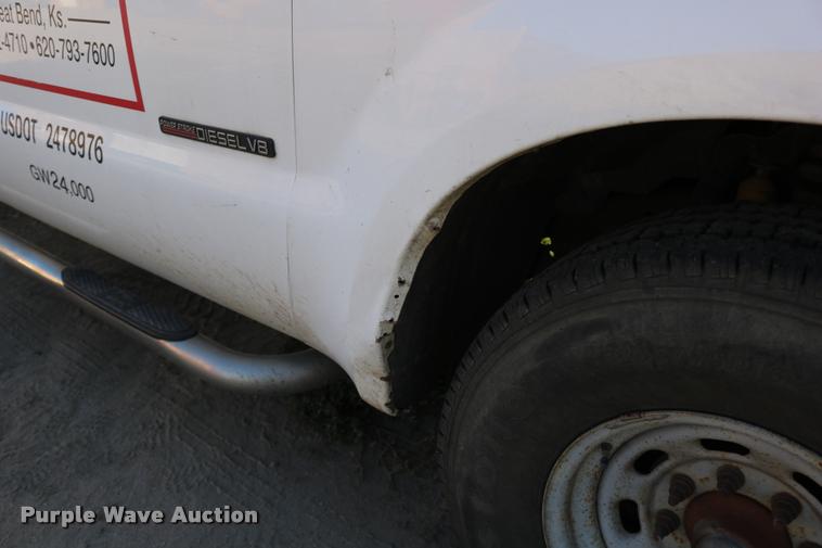 image for item DD0196 1999 Ford F350 Super Duty Crew Cab flatbed pickup truck