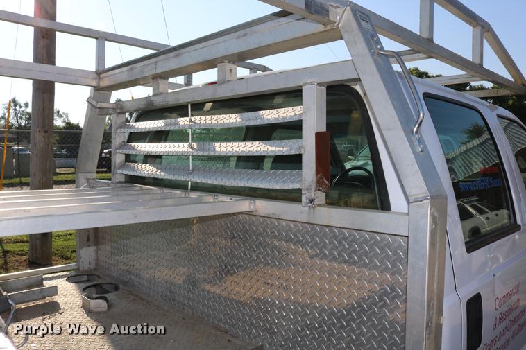 image for item DD0196 1999 Ford F350 Super Duty Crew Cab flatbed pickup truck