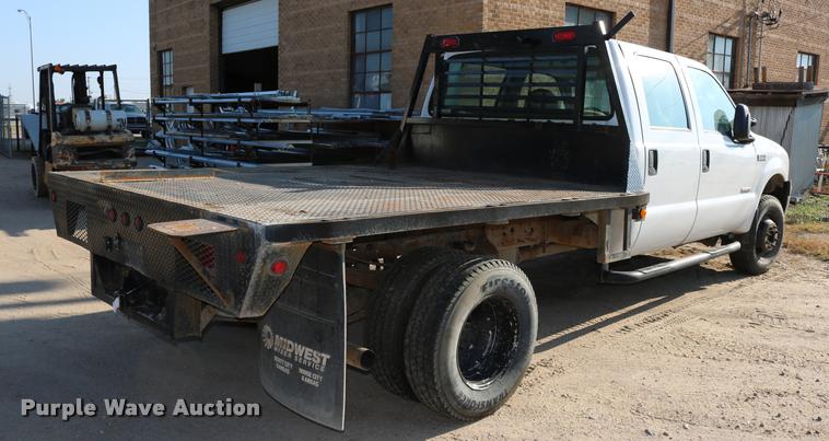 image for item DD0198 2006 Ford F350 Super Duty Crew Cab flatbed pickup truck