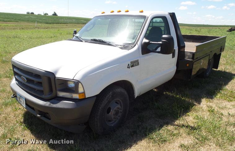 image for item DH9378 2004 Ford F350 Super Duty flatbed pickup truck