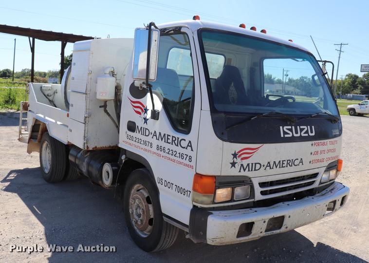 image for item DQ9381 1999 Isuzu NPR vacuum truck