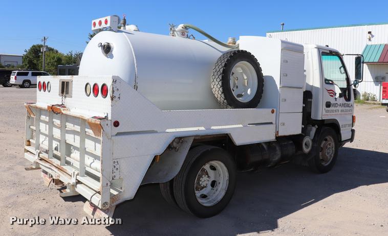 image for item DQ9381 1999 Isuzu NPR vacuum truck