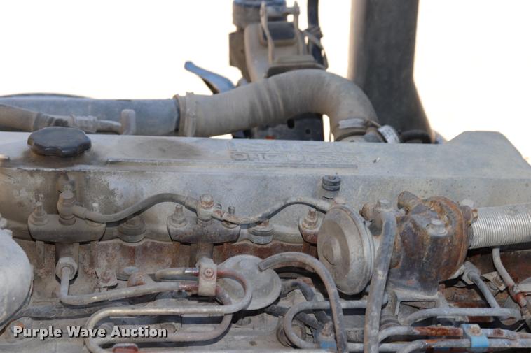 image for item DQ9381 1999 Isuzu NPR vacuum truck