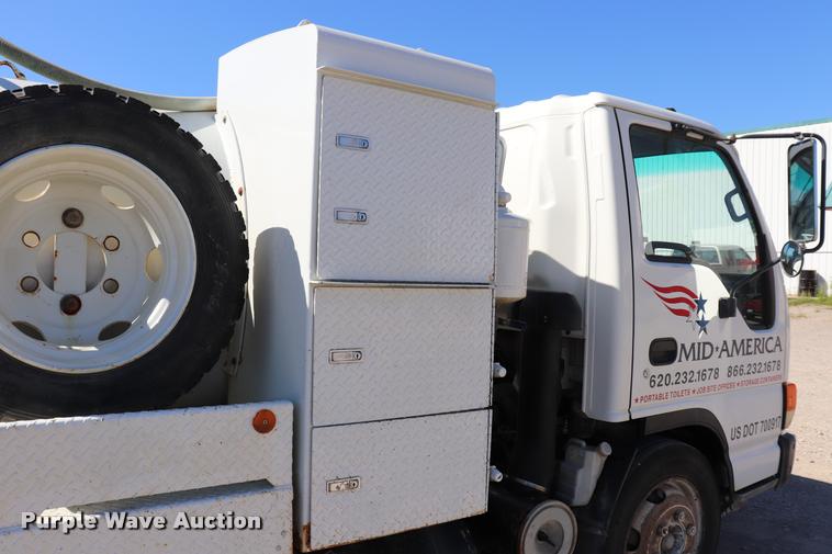 image for item DQ9381 1999 Isuzu NPR vacuum truck