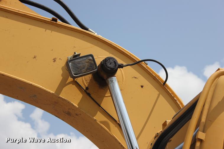 image for item L3207 2000 John Deere 120 excavator