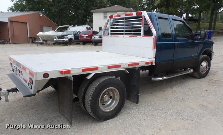 image for item DC5311 2000 Ford F350 Super Duty SuperCab flatbed pickup truck