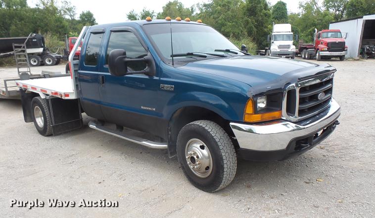 image for item DC5311 2000 Ford F350 Super Duty SuperCab flatbed pickup truck