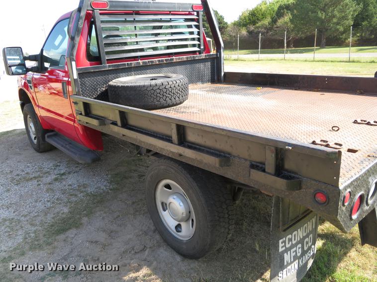 image for item DI9872 2009 Ford F250 Super Duty flatbed pickup truck