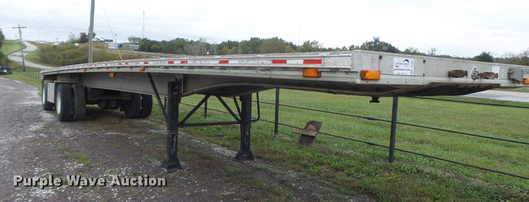 image for item DB9997 1990 East flatbed trailer