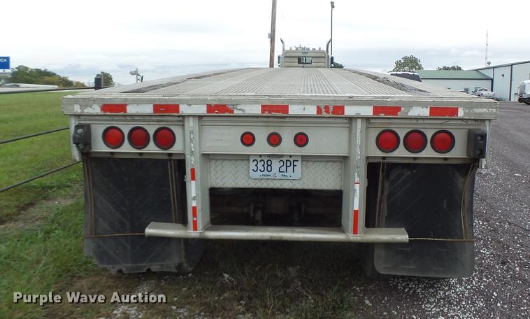 image for item DB9997 1990 East flatbed trailer