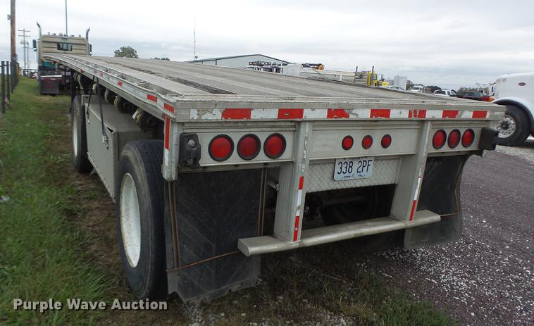 image for item DB9997 1990 East flatbed trailer