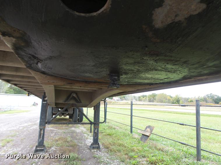 image for item DB9997 1990 East flatbed trailer