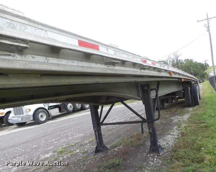 image for item DB9997 1990 East flatbed trailer