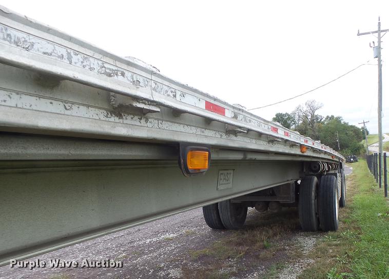image for item DB9997 1990 East flatbed trailer