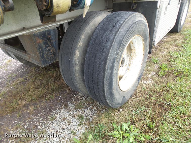 image for item DB9997 1990 East flatbed trailer