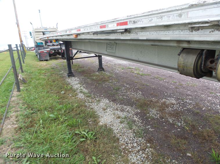 image for item DB9997 1990 East flatbed trailer
