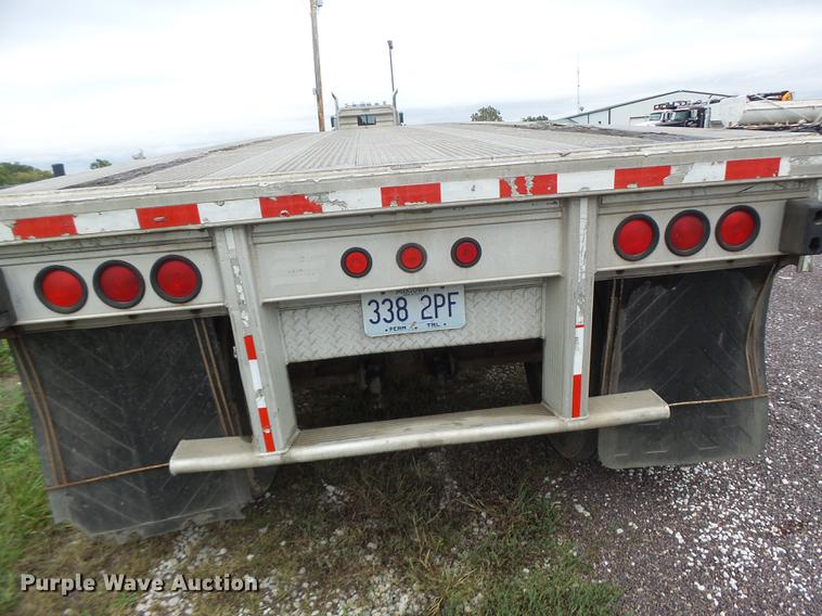 image for item DB9997 1990 East flatbed trailer