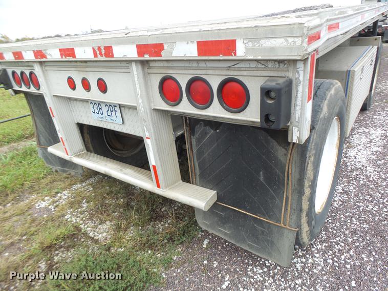 image for item DB9997 1990 East flatbed trailer