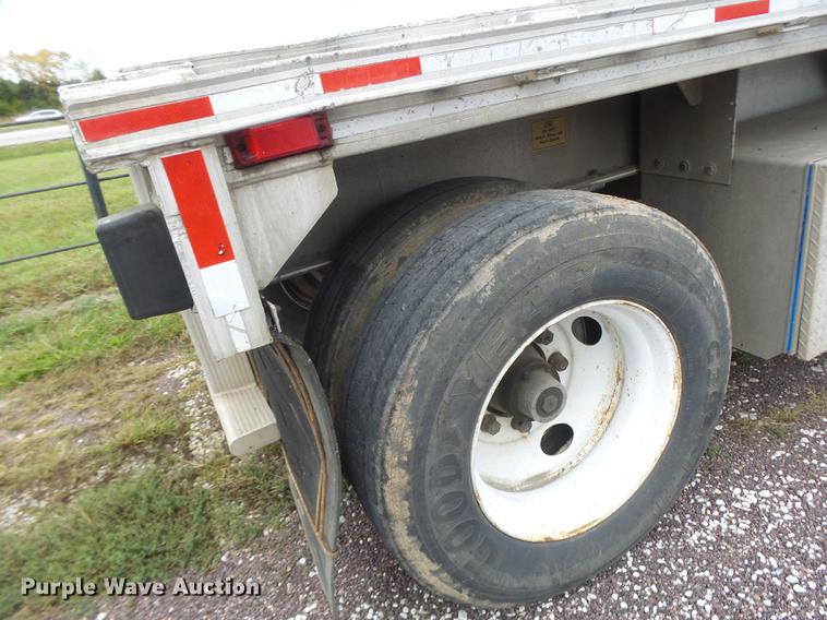 image for item DB9997 1990 East flatbed trailer