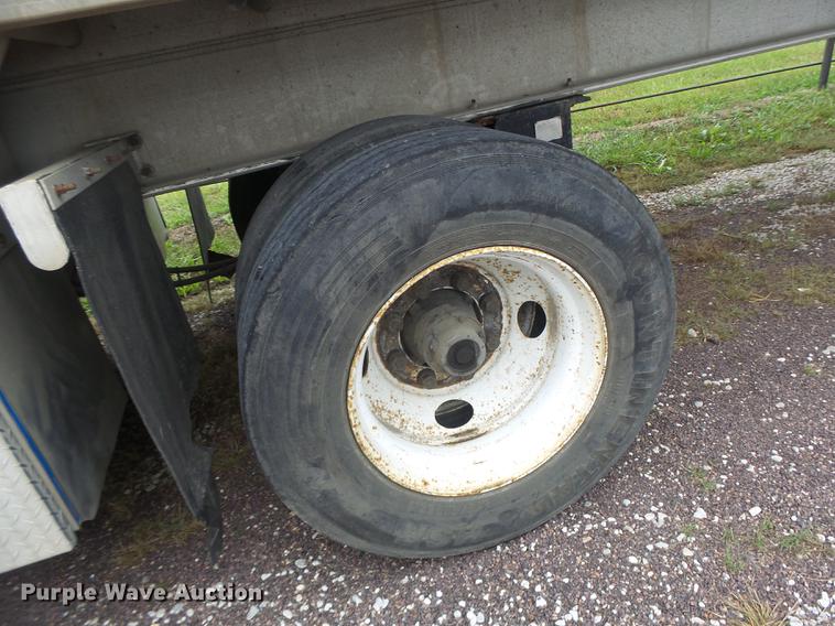 image for item DB9997 1990 East flatbed trailer