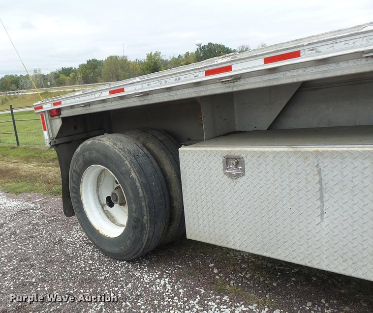 image for item DB9997 1990 East flatbed trailer