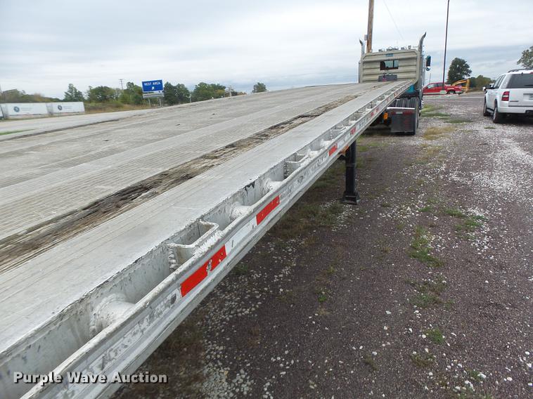image for item DB9997 1990 East flatbed trailer