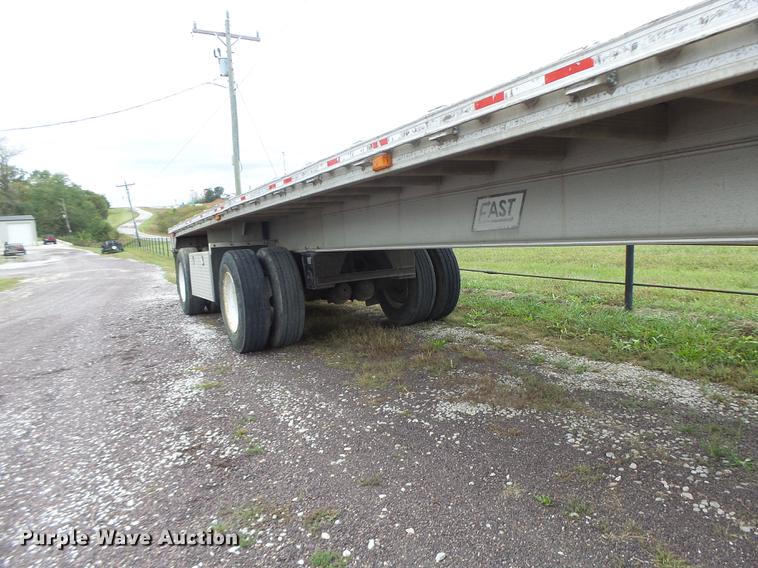 image for item DB9997 1990 East flatbed trailer