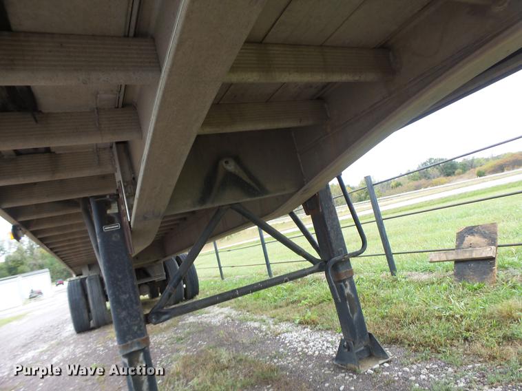 image for item DB9997 1990 East flatbed trailer