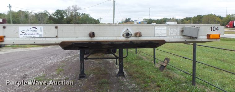 image for item DB9997 1990 East flatbed trailer