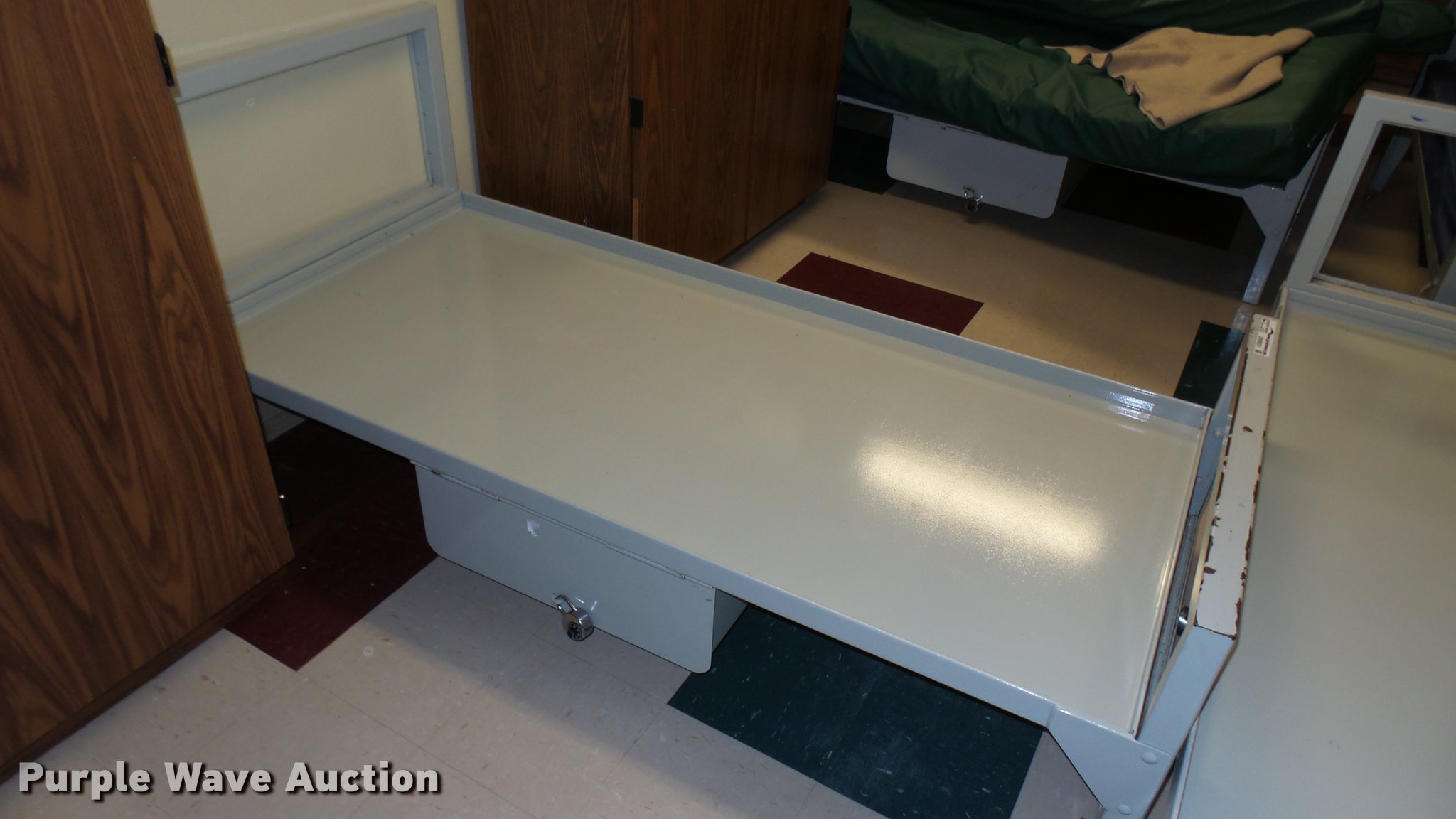 (12) metal prison beds in Wichita, KS Item DW9051 sold Purple Wave