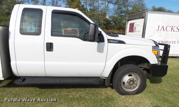 image for item DB7375 2013 Ford F350 Super Duty SuperCab utility bed pickup truck