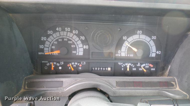 image for item DC1797 1997 GMC C7500 flat dump bed truck