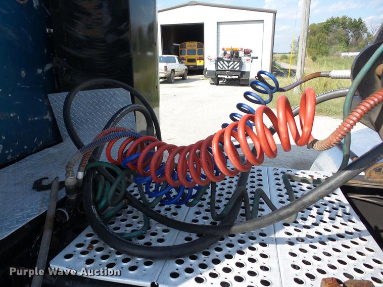 image for item K6361 2005 Kenworth W900 semi truck with tow truck attachment