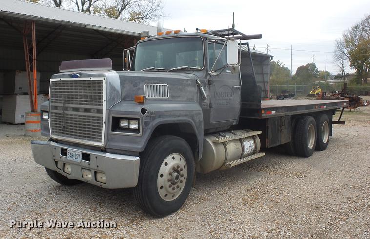 image for item DD9064 1987 Ford LTL9000 flatbed truck