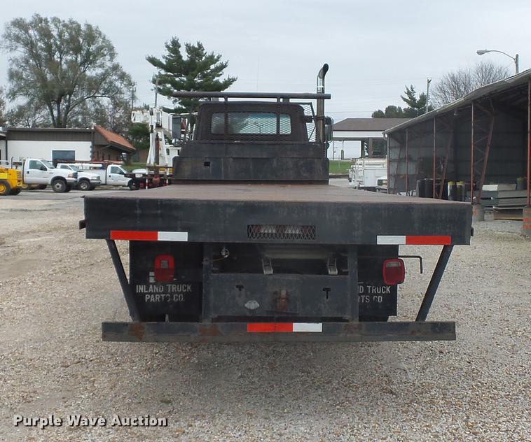 image for item DD9064 1987 Ford LTL9000 flatbed truck