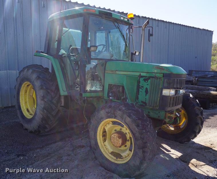 image for item DA1325 2000 John Deere 6310 MFWD tractor