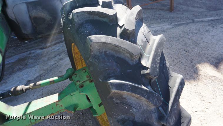 image for item DA1325 2000 John Deere 6310 MFWD tractor