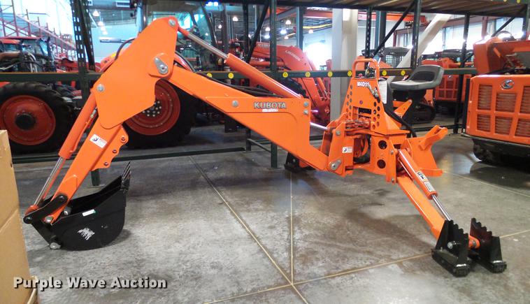 image for item AZ9306 Kubota M4011 backhoe attachment