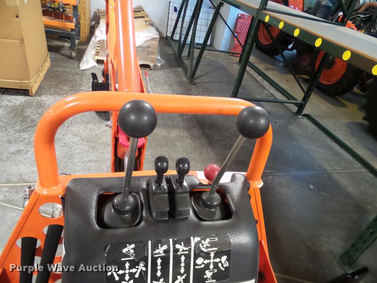 image for item AZ9306 Kubota M4011 backhoe attachment
