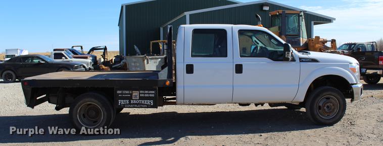 image for item BE9378 2013 Ford F350 Super Duty XL Crew Cab flatbed pickup truck