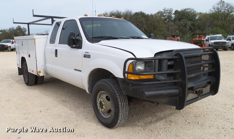 image for item DC2202 1999 Ford F350 Super Duty SuperCab utility bed pickup truck