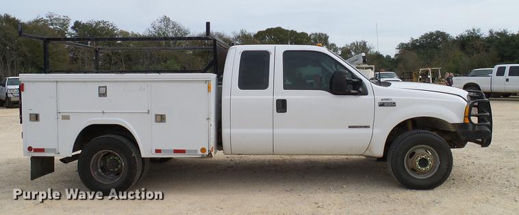 image for item DC2202 1999 Ford F350 Super Duty SuperCab utility bed pickup truck