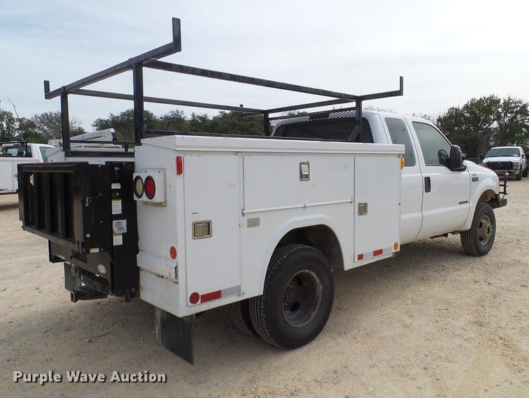 image for item DC2202 1999 Ford F350 Super Duty SuperCab utility bed pickup truck