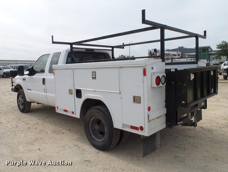 image for item DC2202 1999 Ford F350 Super Duty SuperCab utility bed pickup truck