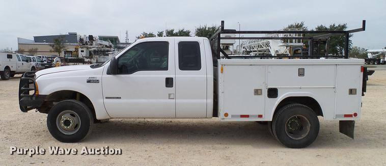 image for item DC2202 1999 Ford F350 Super Duty SuperCab utility bed pickup truck