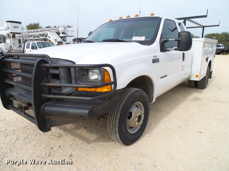 image for item DC2202 1999 Ford F350 Super Duty SuperCab utility bed pickup truck